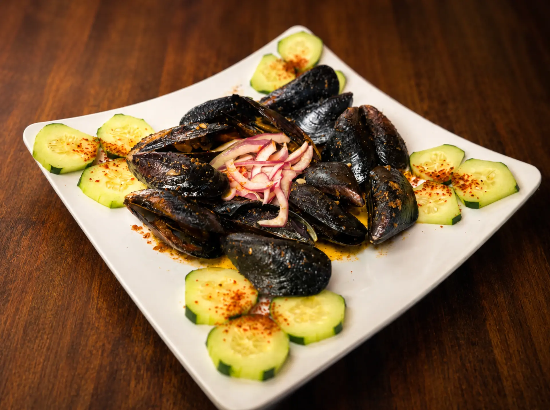 Mejillones with cucumber and pickled red onion